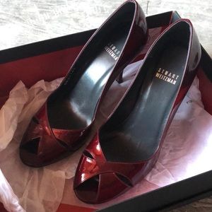 Stuart Weitzman pumps in dark red patent leather.